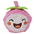 Plush toy resembling a pink fruit with a face on a white background