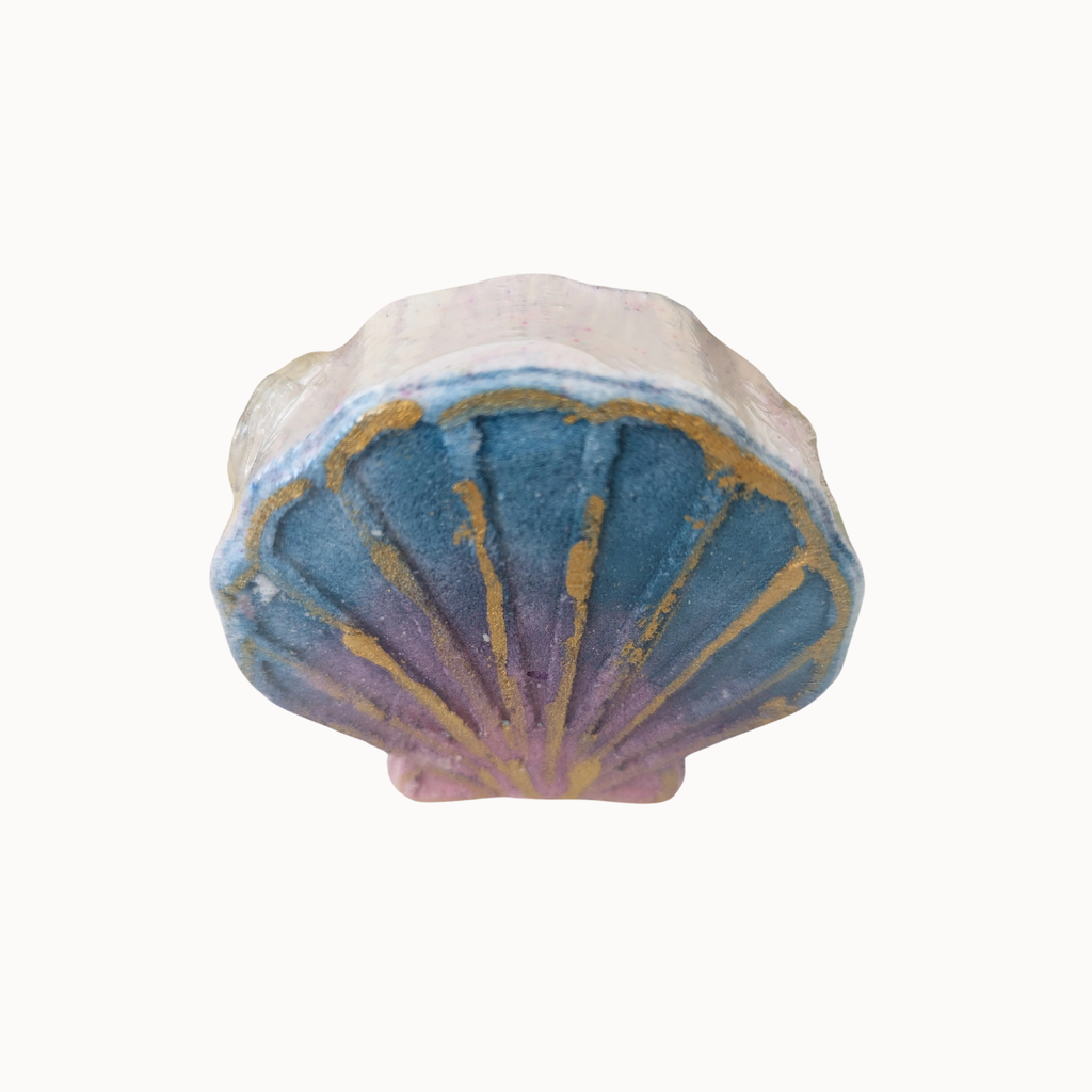 A small shell-shaped decorative object with a blue, purple, and gold fan-like pattern on a plain white background.