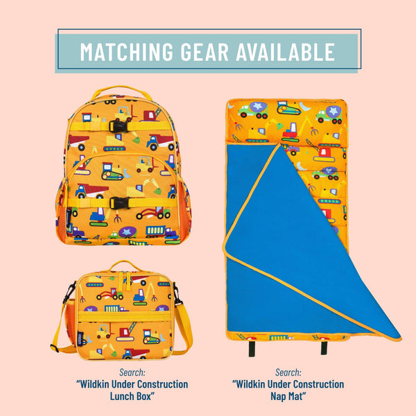 A product listing graphic showing a matching construction-themed gear set on a pale pink background. The set includes a yellow backpack, a matching lunch box, and a folded nap mat, all printed with colorful cartoon construction vehicles and tools.