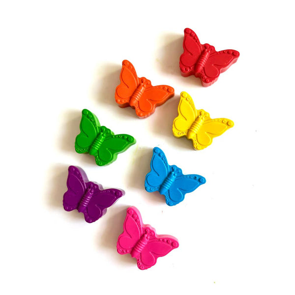 Colorful butterfly-shaped crayons on a white background
