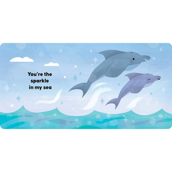 Two dolphins in the ocean with a quote on a blue background