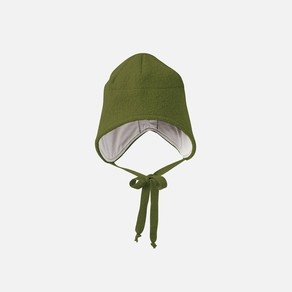 A green Disana boiled wool hat with ties for adjustment, displayed against a white background.