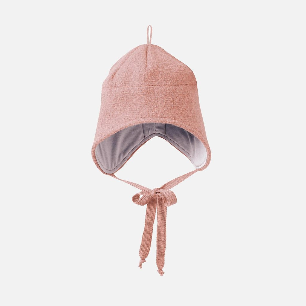 A rose pink Disana boiled wool hat with ties for adjustment, displayed against a white background.