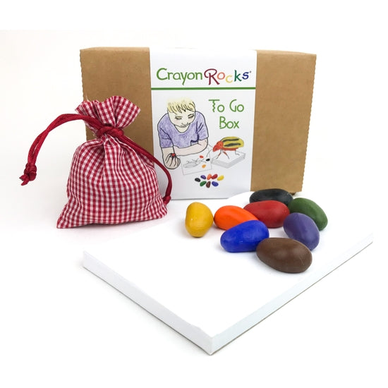 A to-go box containing 8 colorful crayons shaped like rocks, displayed with a small red and white checkered bag.