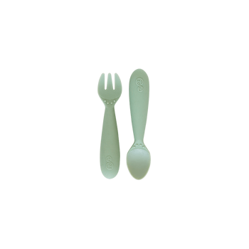 Packaged mini utensils consisting of a fork and spoon designed for toddlers, with a gray color and sensory features.