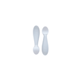 Two white silicone spoons designed for babies, with wide handles and narrow bowls.